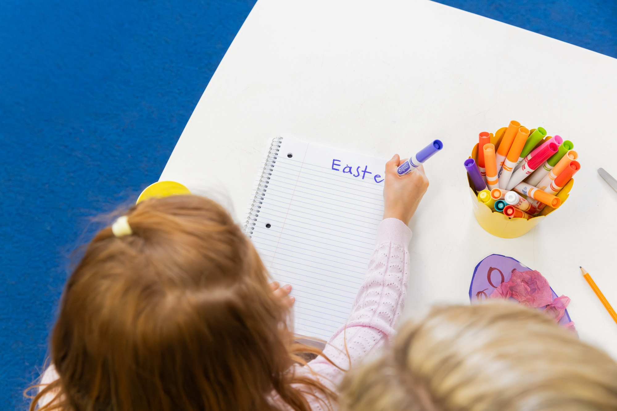 Child practicing pre-writing skills for kindergarten during intensive program