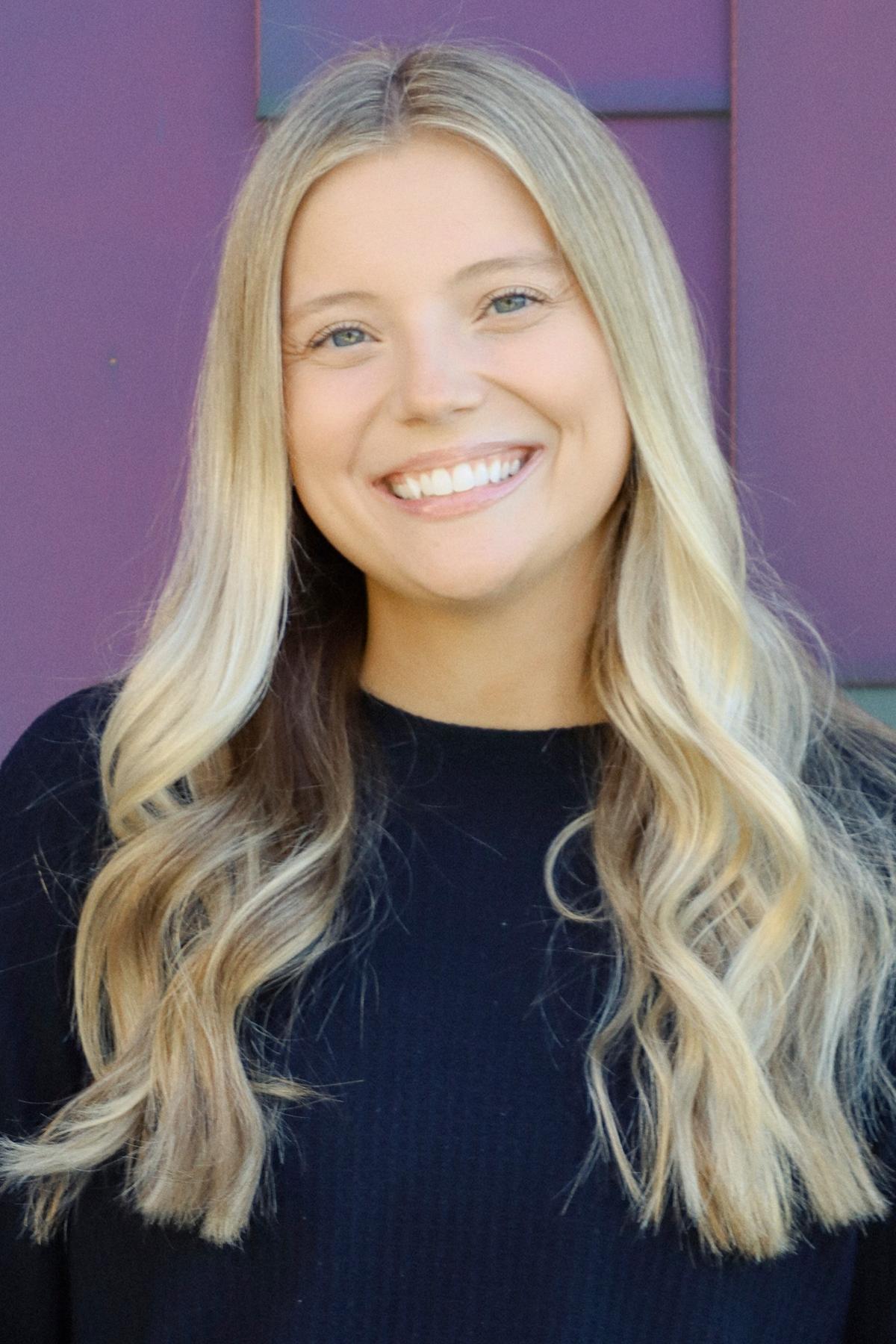 Occupational Therapist, blonde hair and black shirt