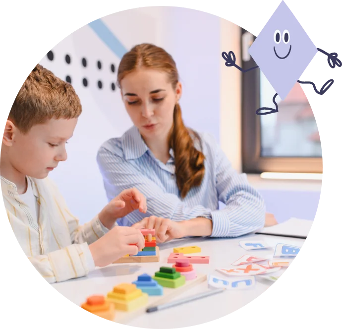 School therapist working with a child on stacking activities